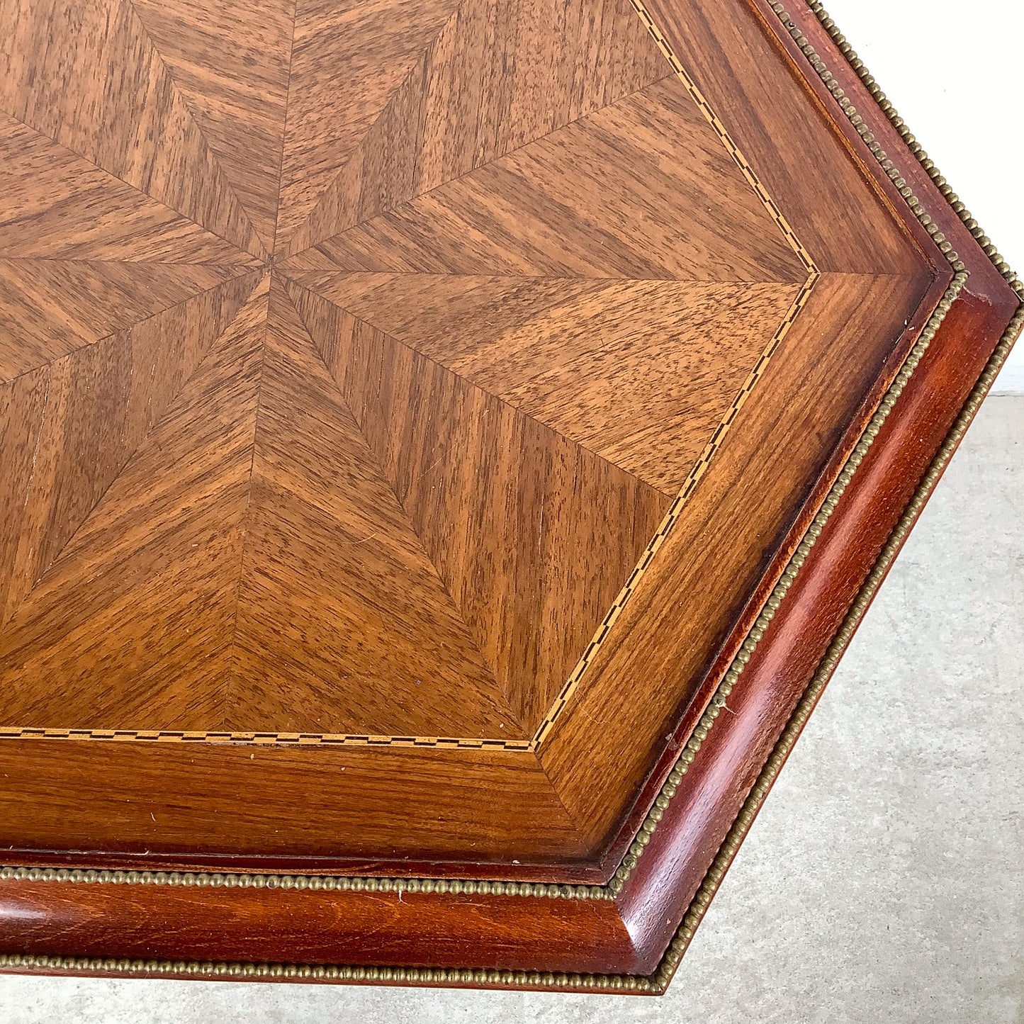 Ornate Pedestal Display Table with Brass Figural Accents