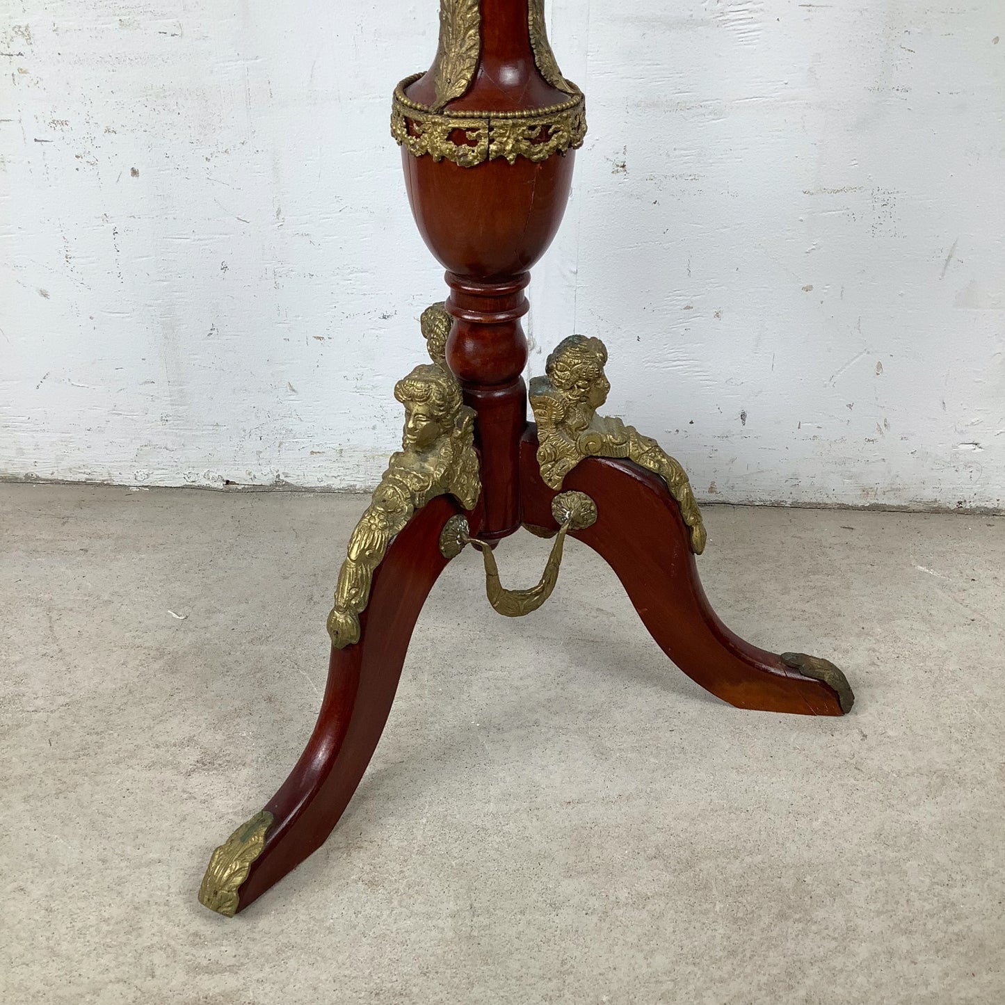 Ornate Pedestal Display Table with Brass Figural Accents
