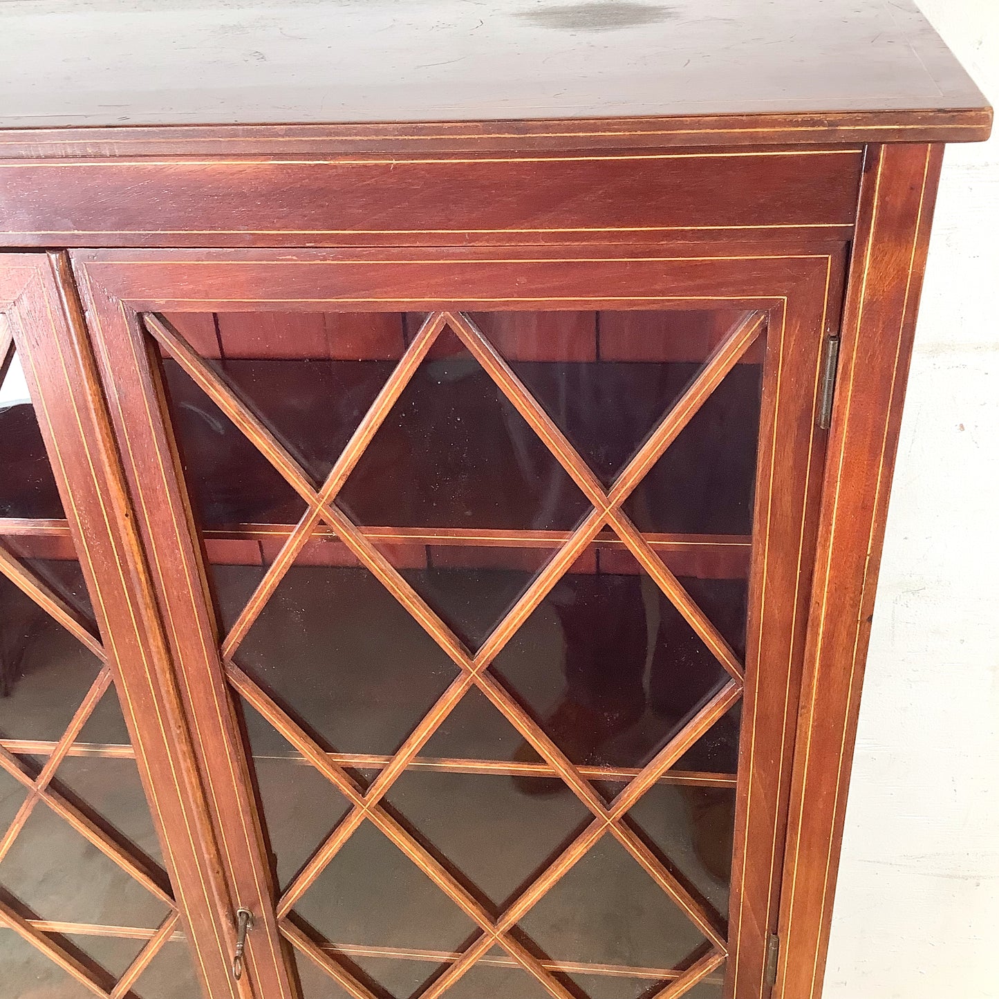 Edwardian Revival Mahogany Diamond Lattice Glazed Bookcase | Satinwood Inlay | Brass Casters