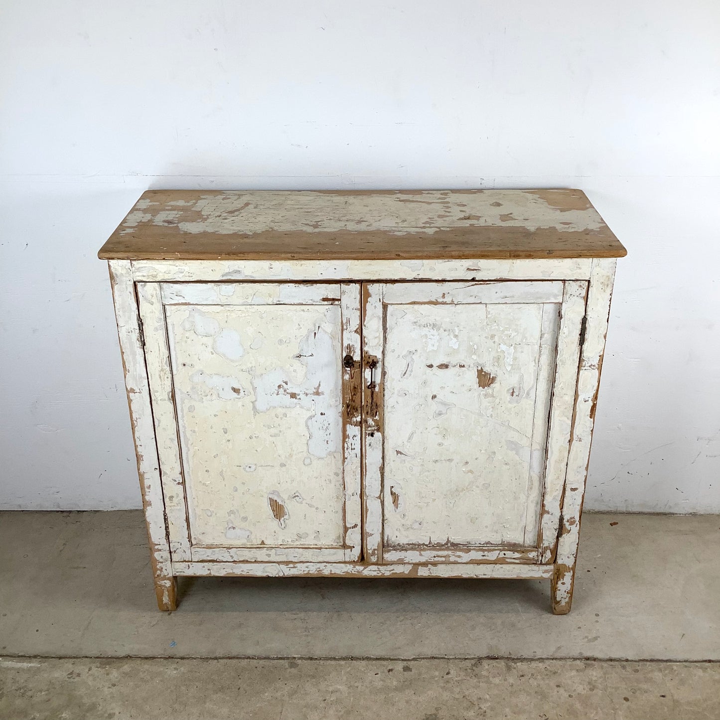 Rustic 20th Century Two-Door Cabinet – Distressed White Patina with Ample Storage