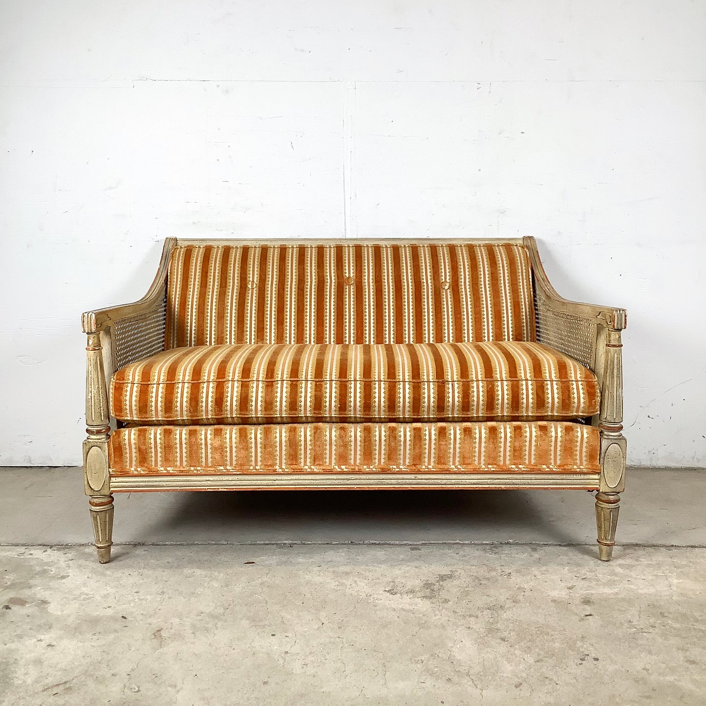 French Louis XVI Style Cane Settee With Elegant Striped Upholstery