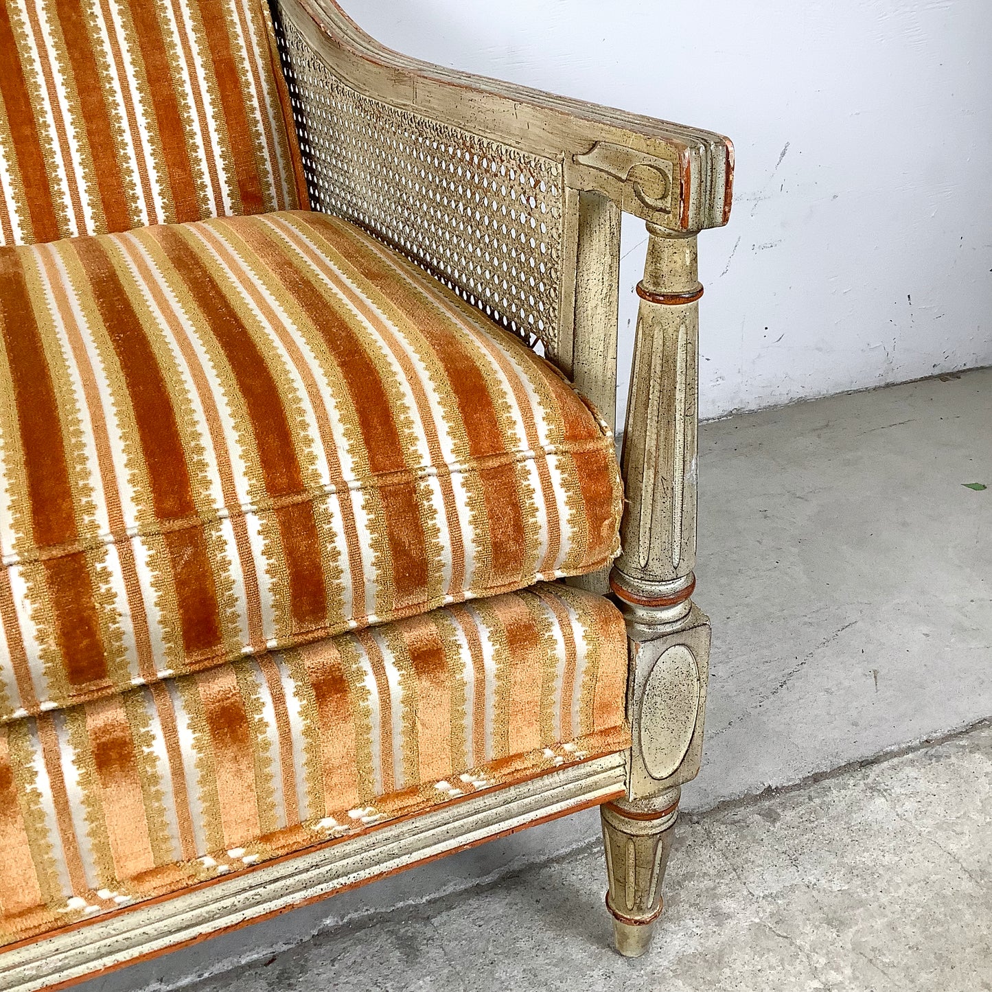 French Louis XVI Style Cane Settee With Elegant Striped Upholstery