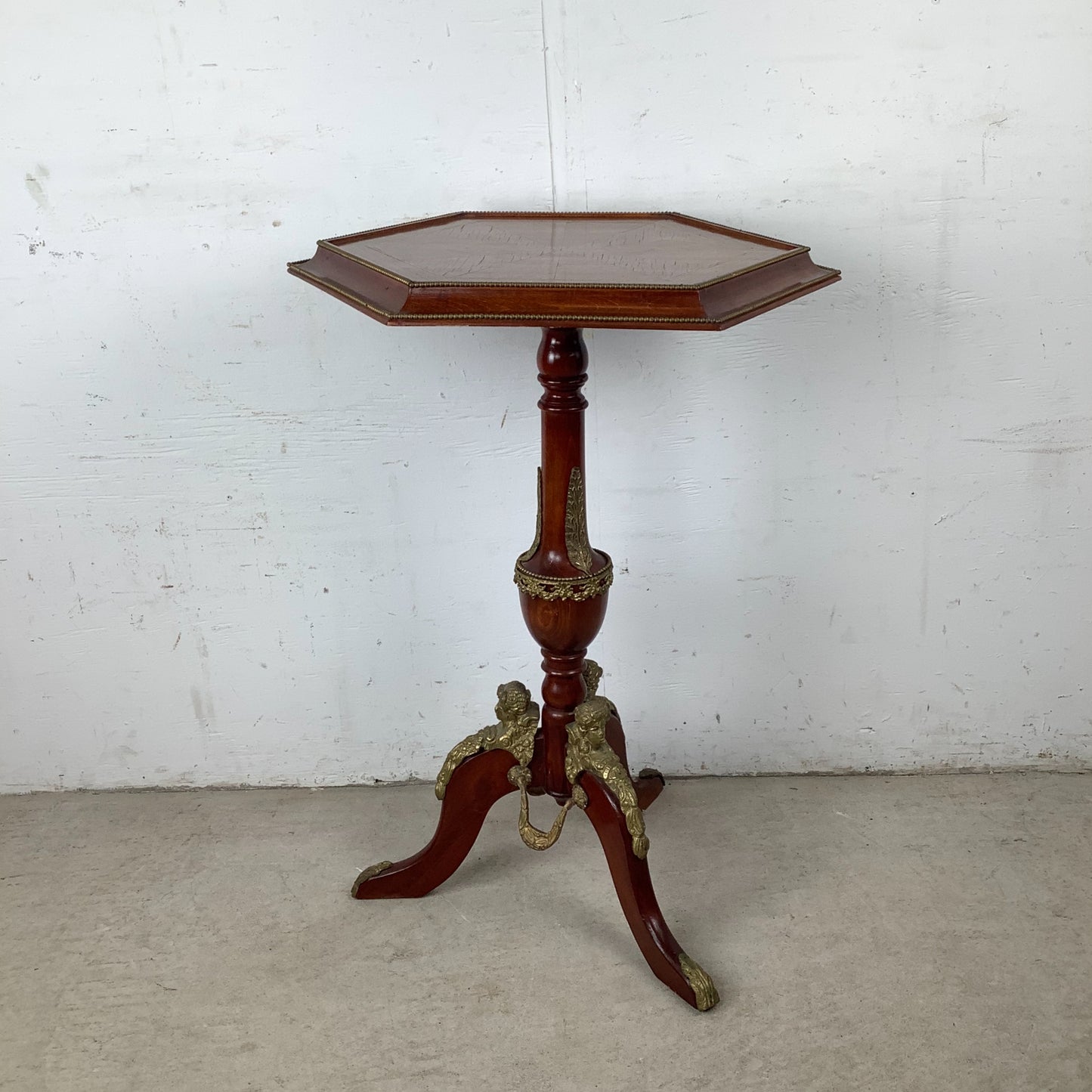 Ornate Pedestal Display Table with Brass Figural Accents