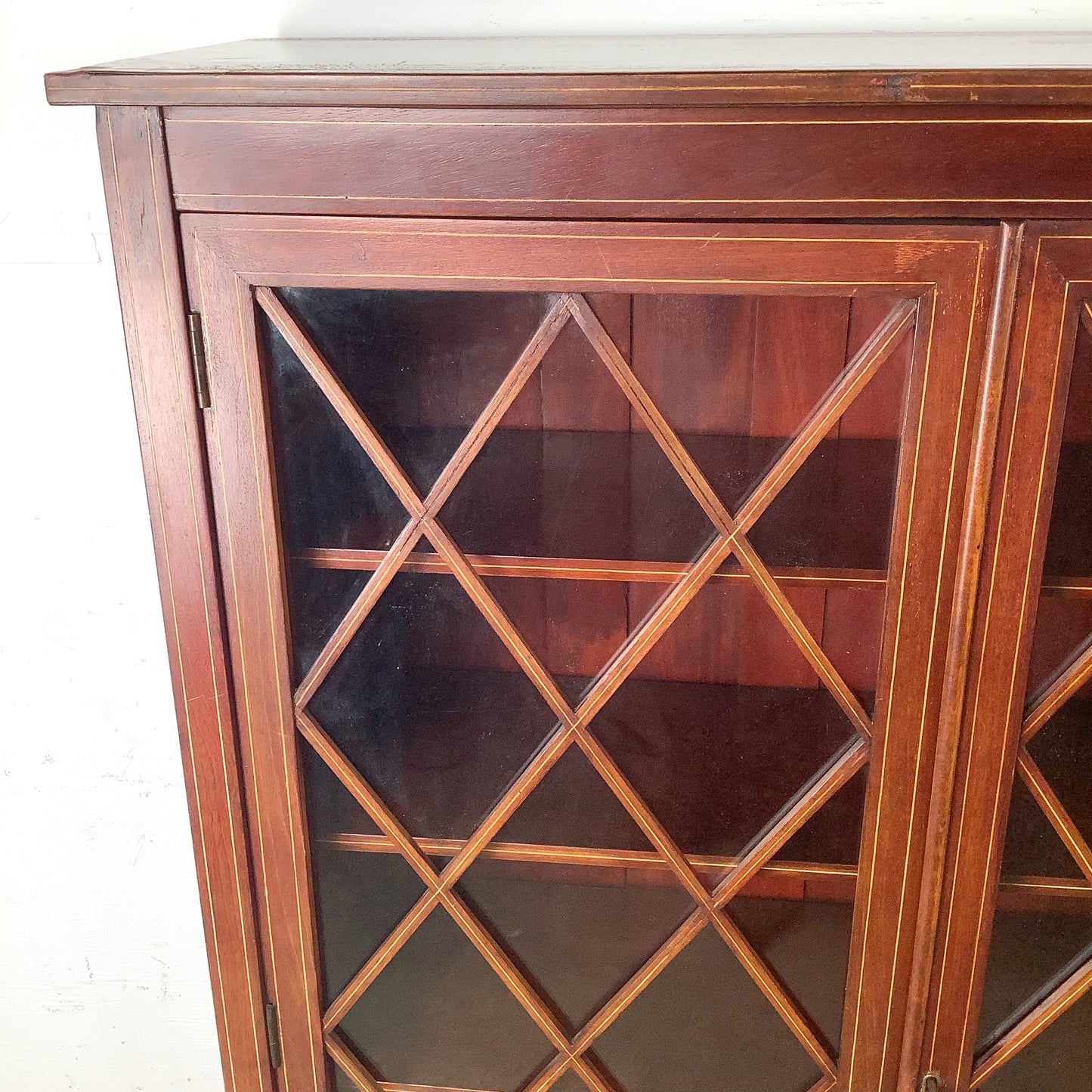 Edwardian Revival Mahogany Diamond Lattice Glazed Bookcase | Satinwood Inlay | Brass Casters