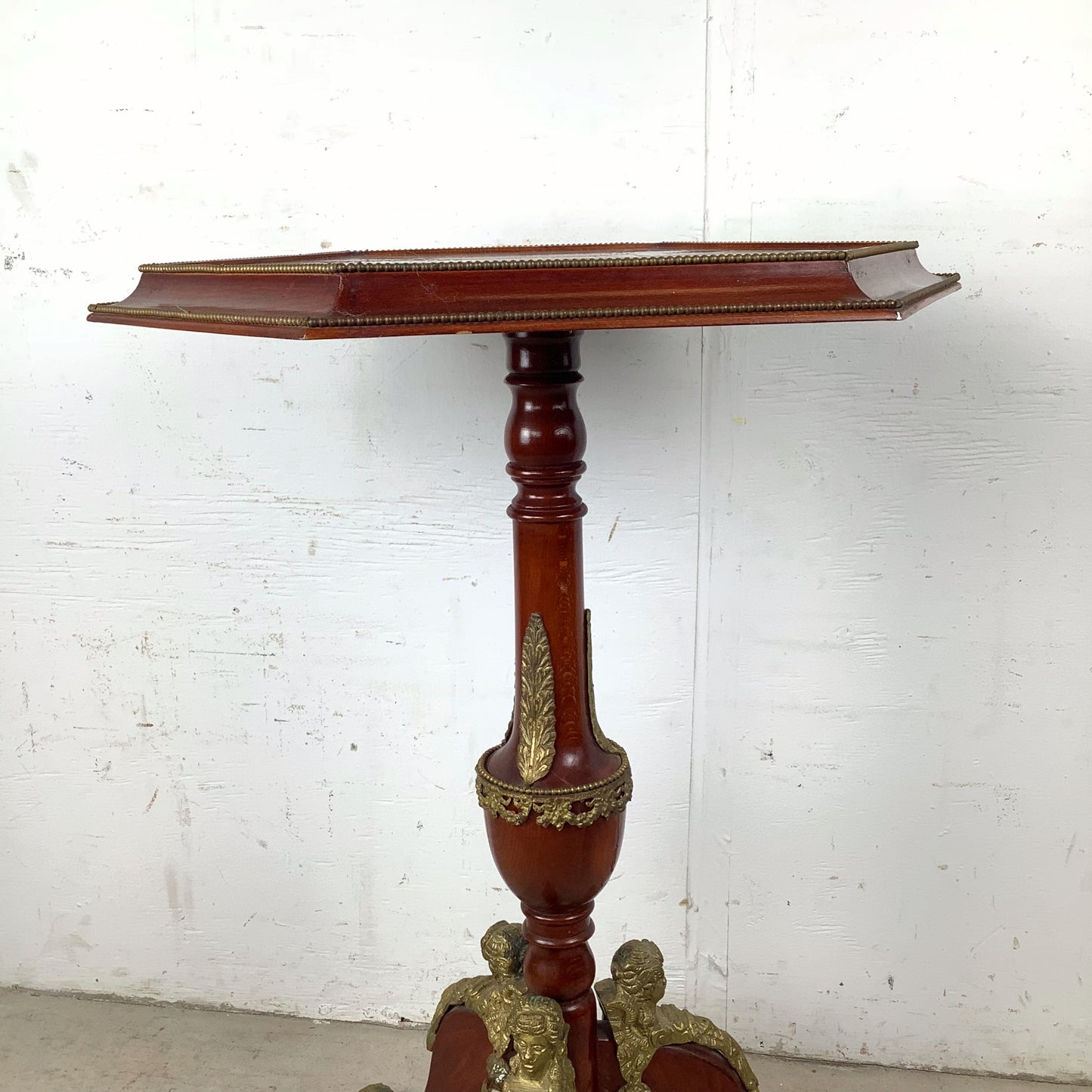 Ornate Pedestal Display Table with Brass Figural Accents