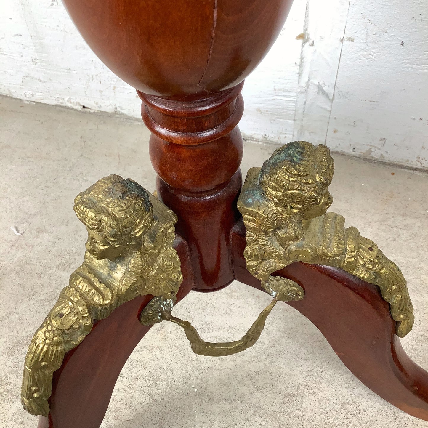 Ornate Pedestal Display Table with Brass Figural Accents
