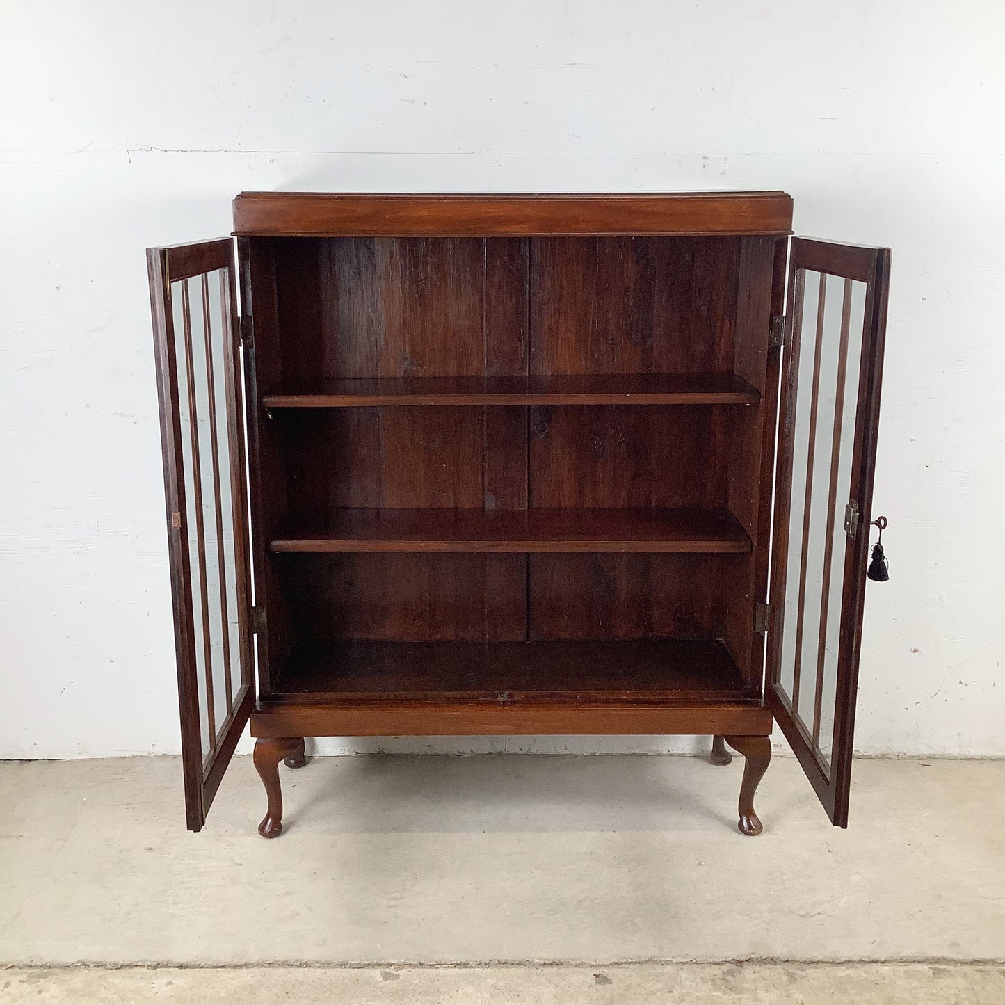 Classic Glass-Front Bookcase with Paneled Doors and Sculpted Legs