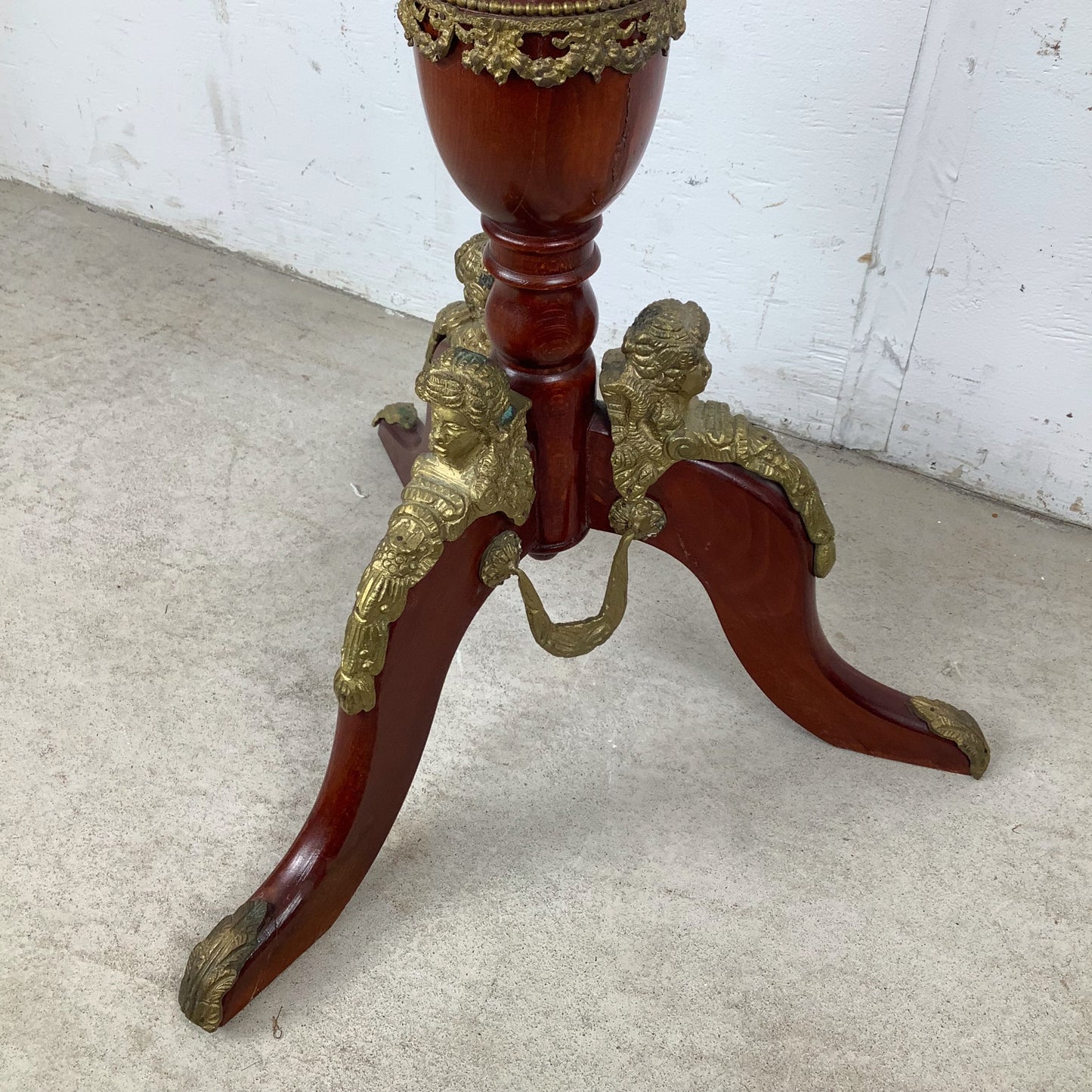 Ornate Pedestal Display Table with Brass Figural Accents
