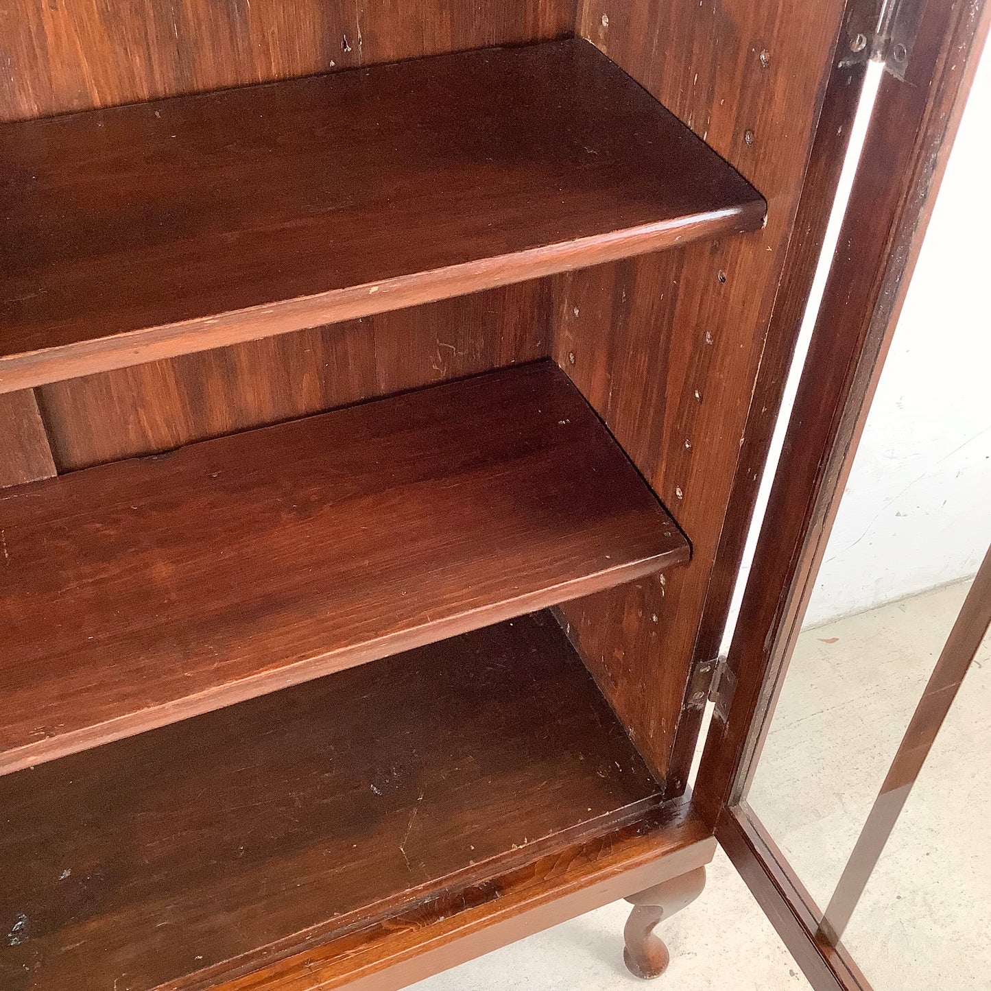 Classic Glass-Front Bookcase with Paneled Doors and Sculpted Legs