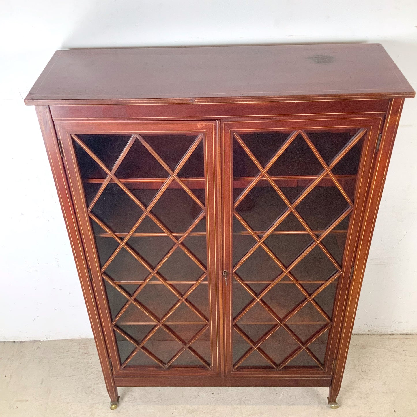 Edwardian Revival Mahogany Diamond Lattice Glazed Bookcase | Satinwood Inlay | Brass Casters