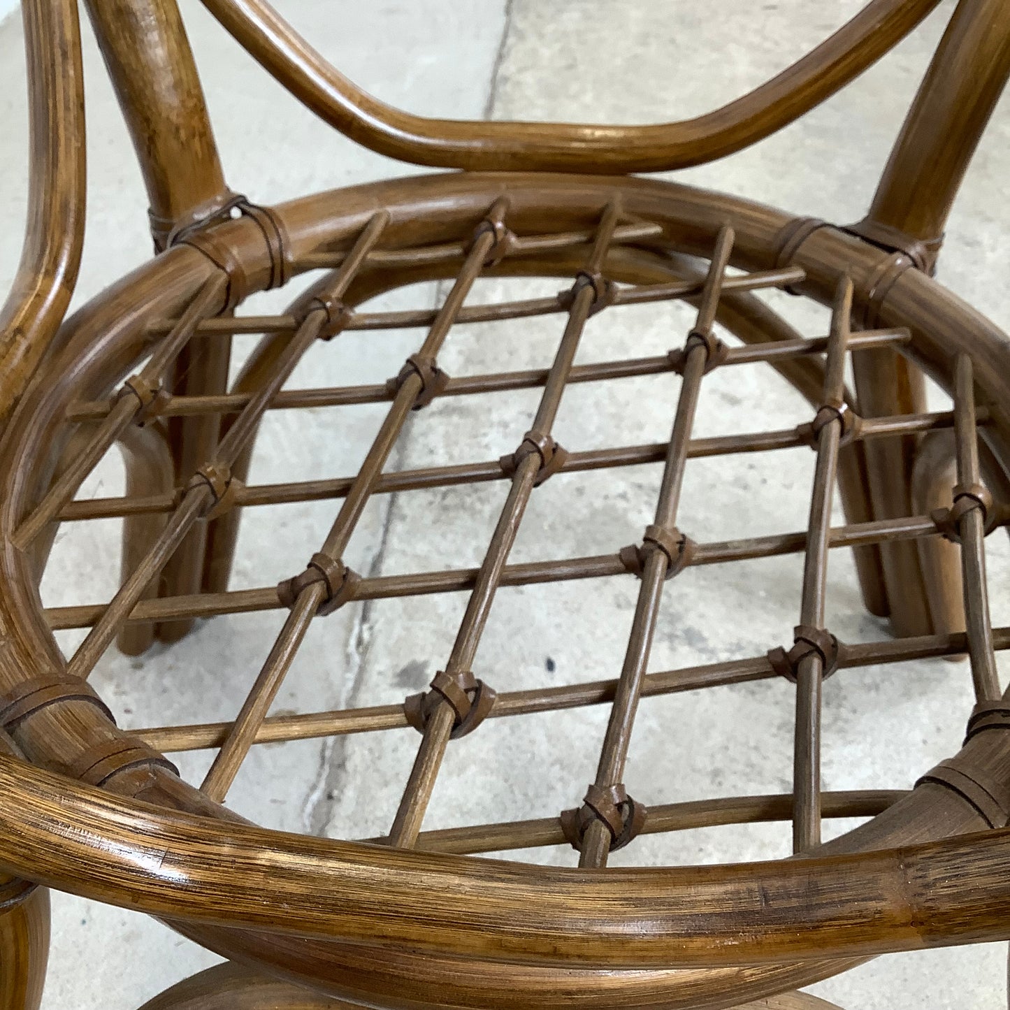 Vintage Rattan Dining Table | Sculptural Swept-Leg Base | Woven Lower Shelf | Oval Glass Top | c. 1970s–1980s