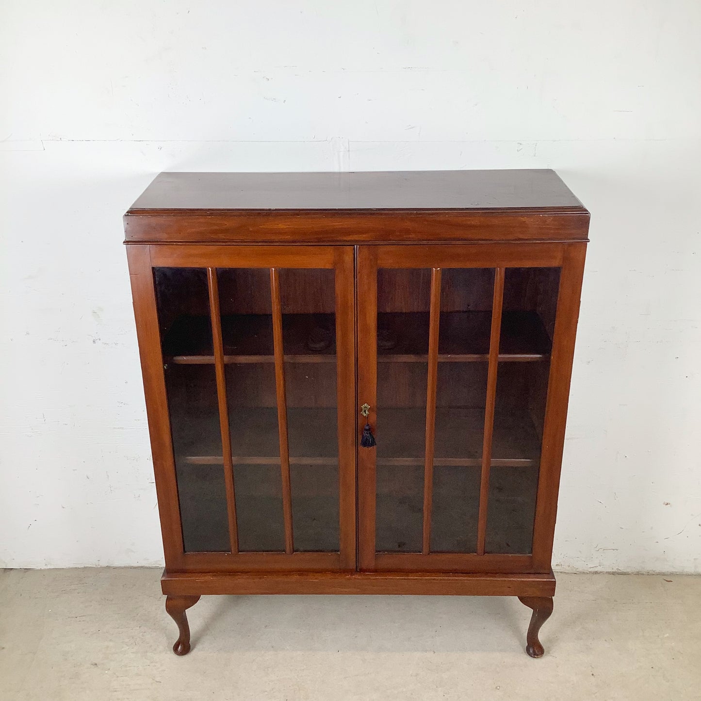 Classic Glass-Front Bookcase with Paneled Doors and Sculpted Legs
