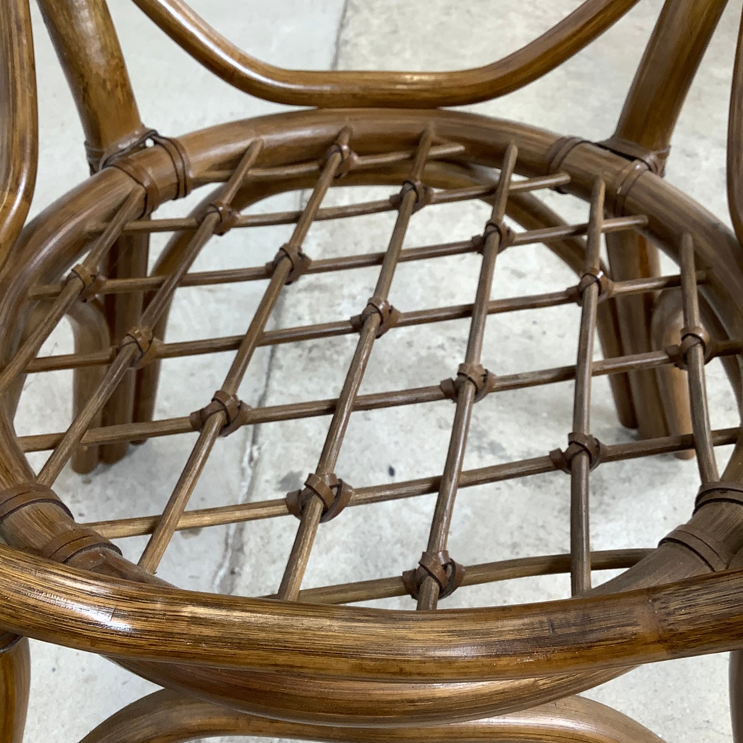 Vintage Rattan Dining Table | Sculptural Swept-Leg Base | Woven Lower Shelf | Oval Glass Top | c. 1970s–1980s