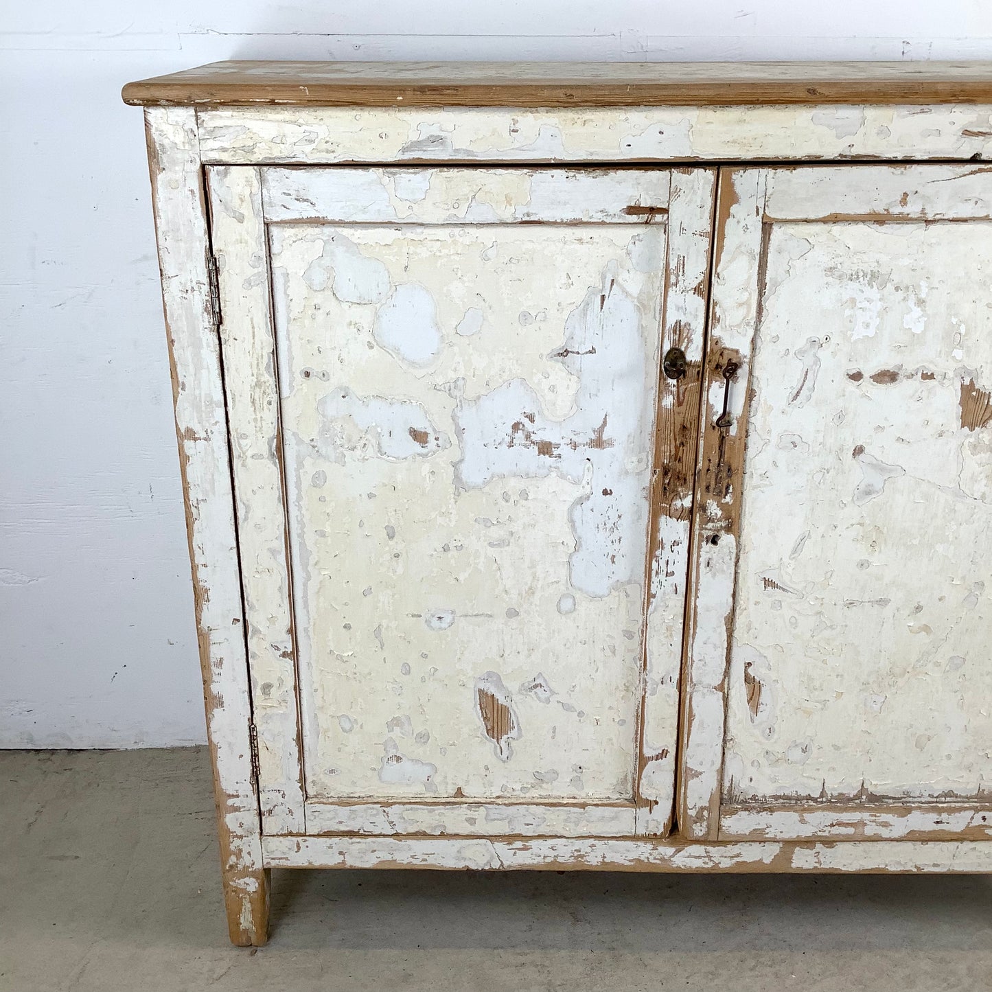 Rustic 20th Century Two-Door Cabinet – Distressed White Patina with Ample Storage