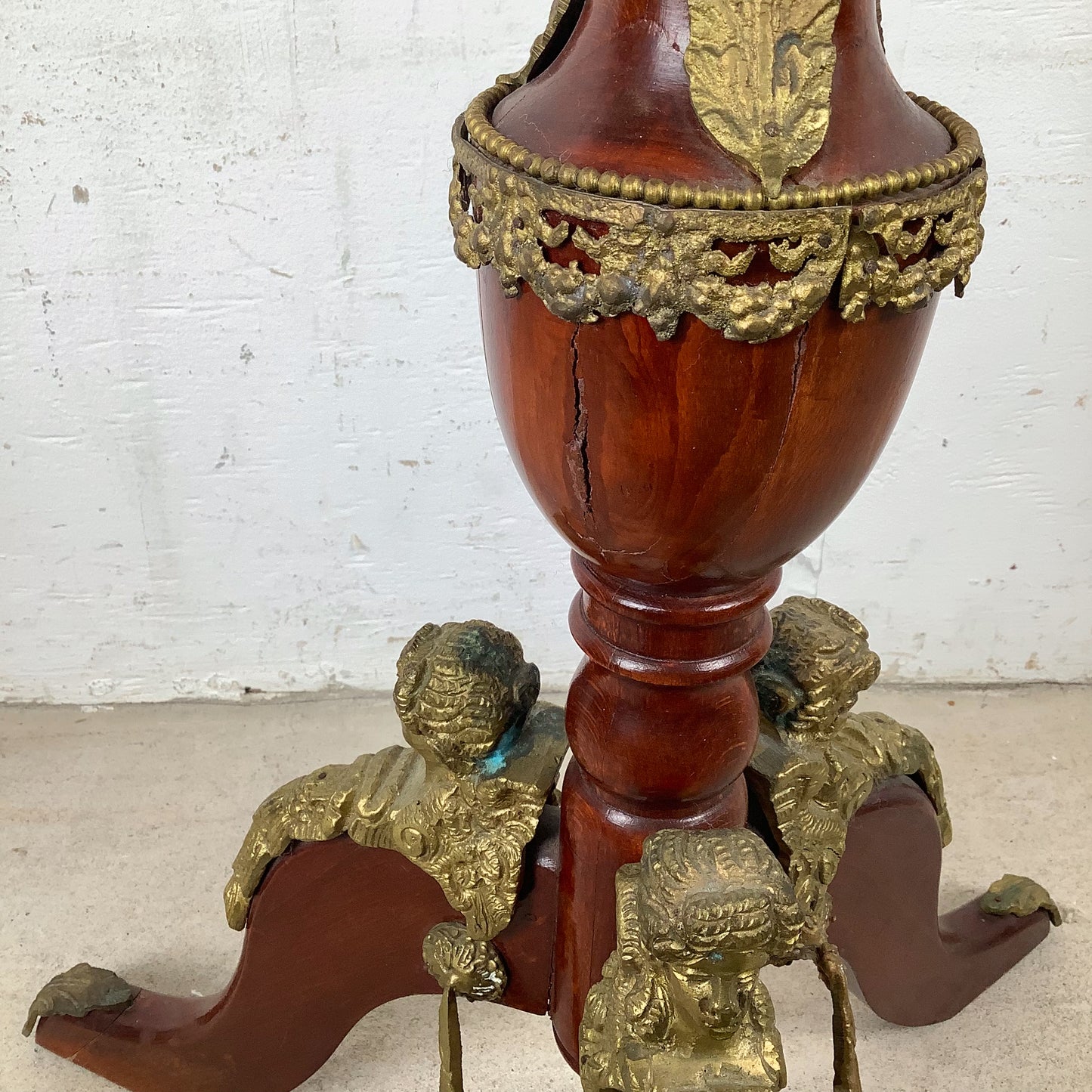 Ornate Pedestal Display Table with Brass Figural Accents