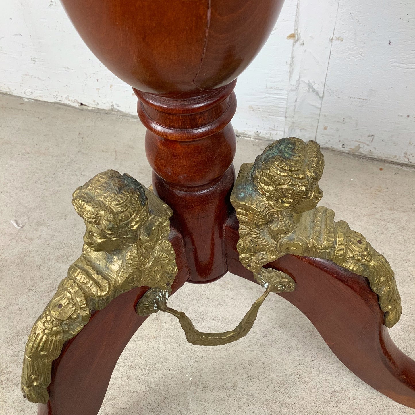 Ornate Pedestal Display Table with Brass Figural Accents