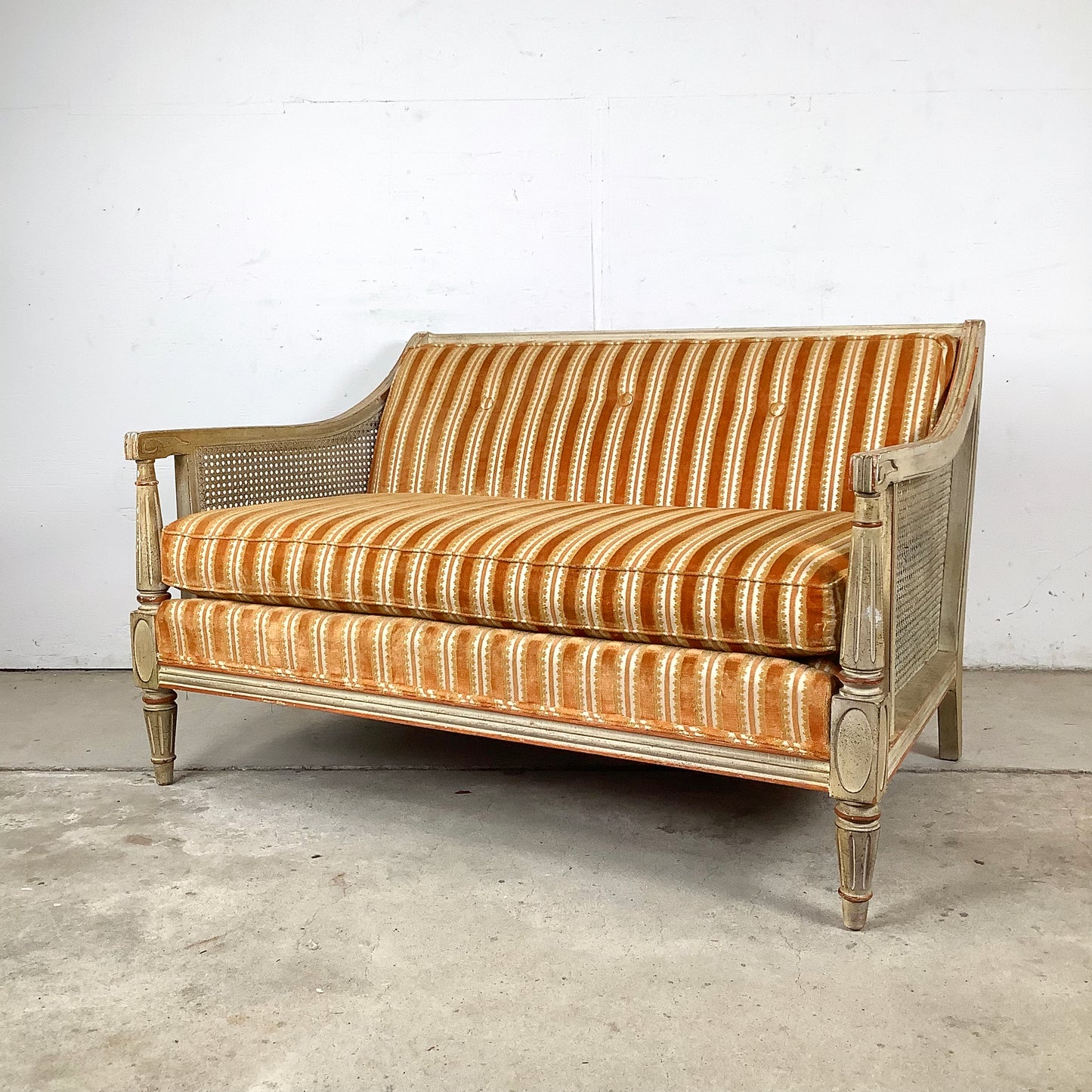 French Louis XVI Style Cane Settee With Elegant Striped Upholstery