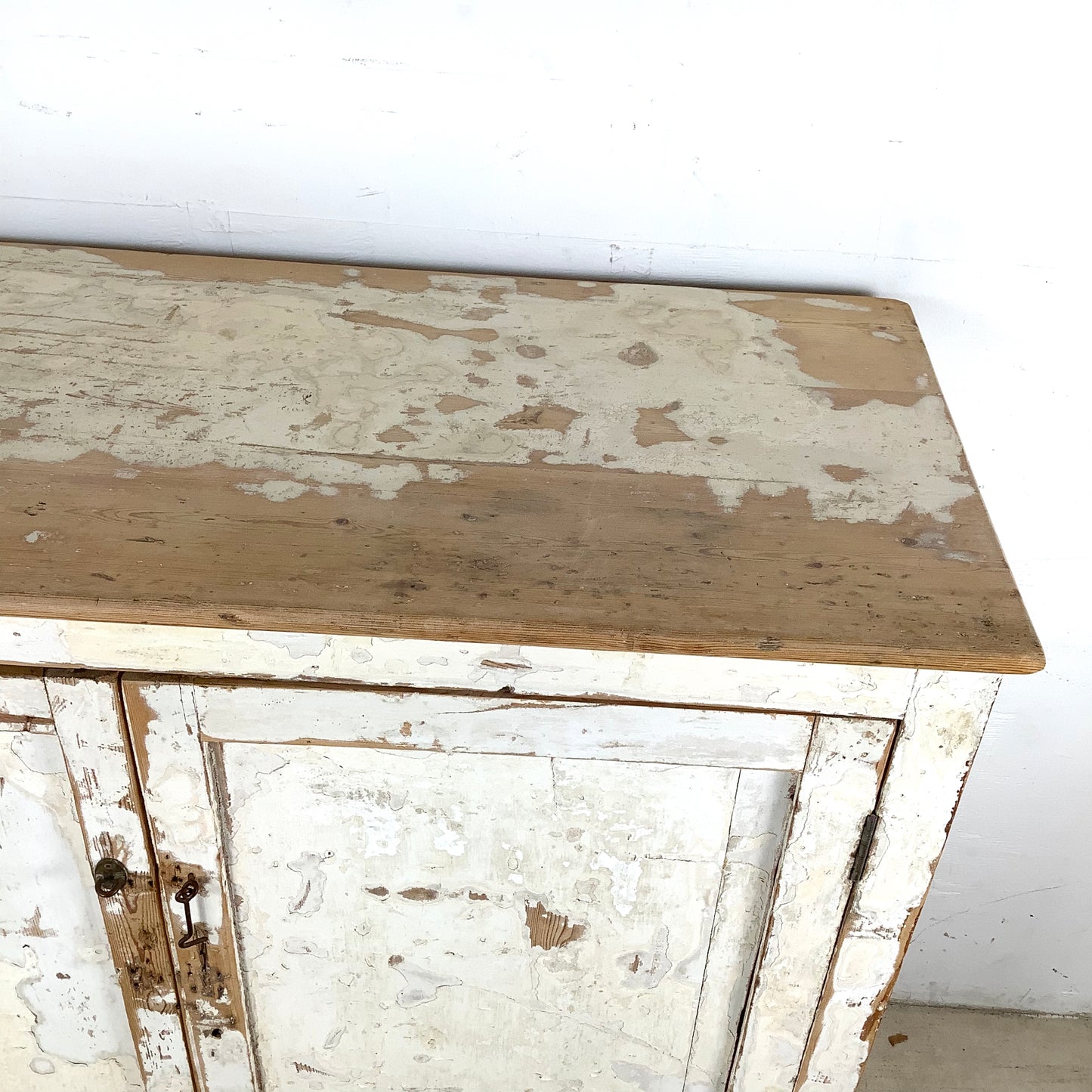Rustic 20th Century Two-Door Cabinet – Distressed White Patina with Ample Storage