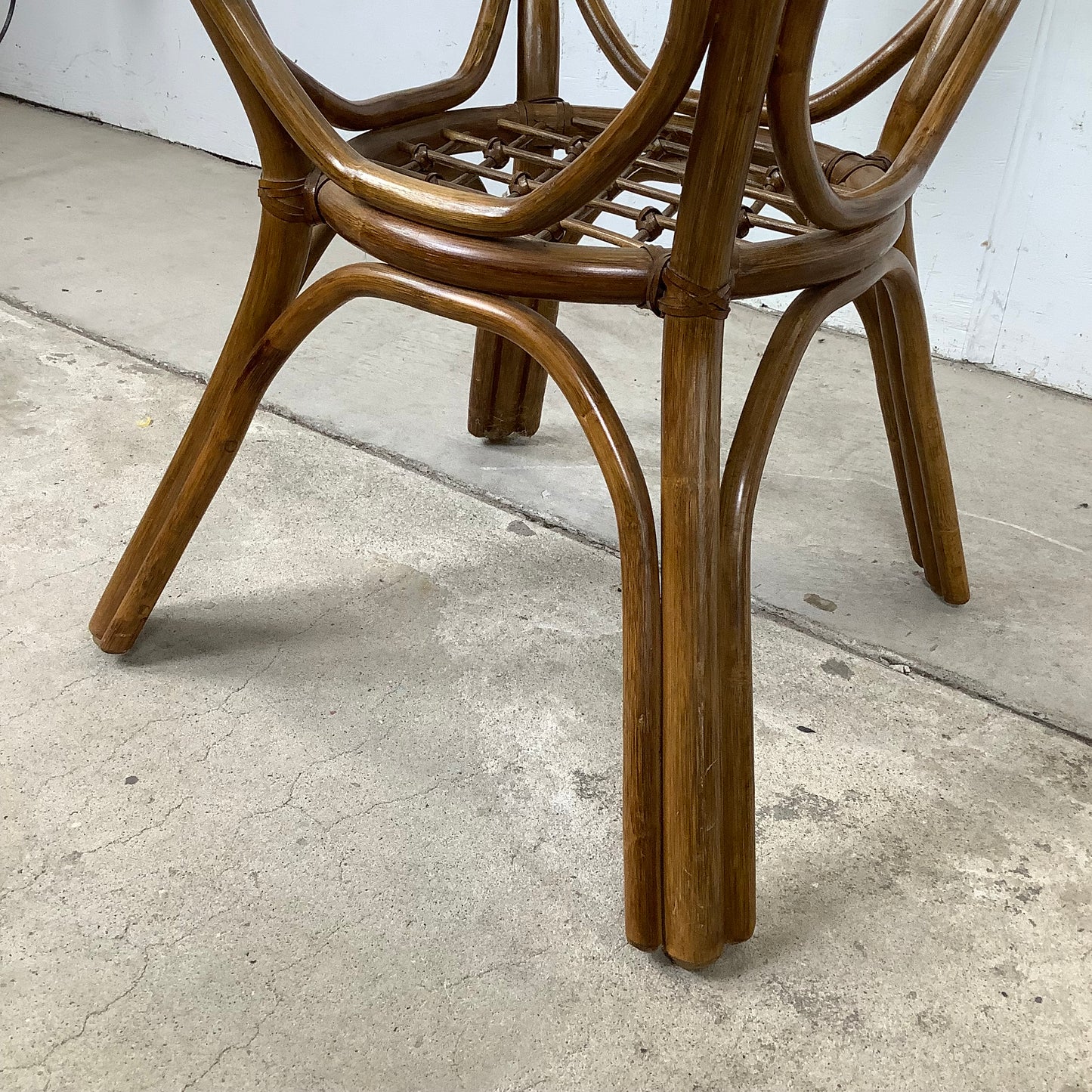 Vintage Rattan Dining Table | Sculptural Swept-Leg Base | Woven Lower Shelf | Oval Glass Top | c. 1970s–1980s